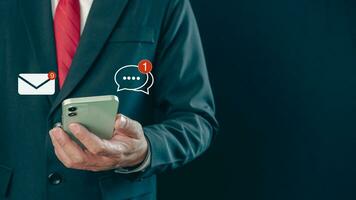 Businessman checking email on the phone screen. New email notification concept for business email communication and digital marketing. Inbox receives notification of electronic messages. photo