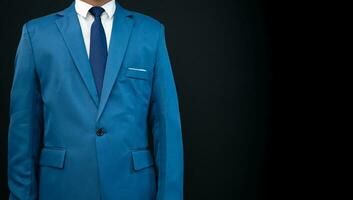 businessman standing on dark  background. business concept. suit. photo