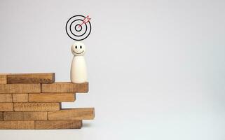 wood doll stand on woods block step with icon Action plan, Goal and target, success and business target concept, project management, company strategy photo