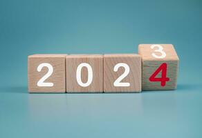 Wooden blocks lined up with the letters 2024. Represents the goal setting for 2024, the concept of a start. financial planning development strategy business goal setting photo