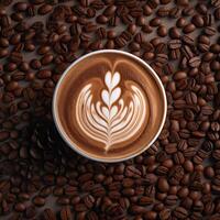 Coffee cup with latte art on coffee beans background. photo