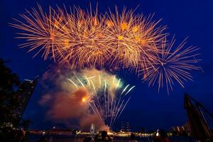 fireworks on the river in the dark sky photo