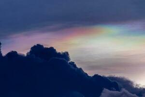 Iridescent Cloud or irisation is a colorful optical phenomenon that occurs in a cloud. photo