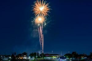 fireworks on the river in the dark sky photo