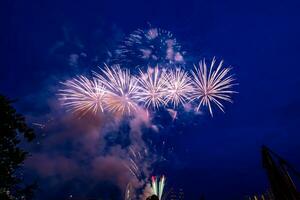 fireworks on the river in the dark sky photo