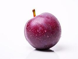 A plum fruit is isolated on a white background photo