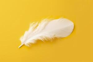 Close up of bright white feather. Copy space, yellow background. Fashion and Party concept. AI Generative photo