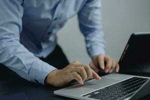 Businessperson using keyboard laptop computer job search, communication social networking, internet online Information, working data marketing concept. photo