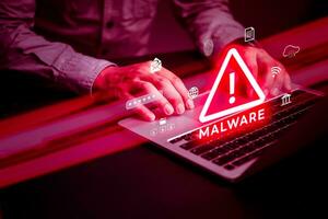 hacker uses malware with laptop computer hack password the personal data and money from Bank accounts.Scam Virus Spyware Malware Antivirus digital technology internet online Concept. photo