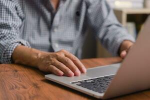 Businessperson using keyboard laptop computer job search, communication social networking, internet online Information, working data marketing concept. photo