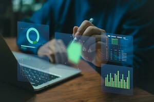 Business development and technology Data analyst for report marketing strategy planning. graph analysis and information on a futuristic virtual interface screen. photo