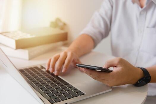 Man using touchscreen smartphone to stay connected, browse the internet, access information, and engage with social media. photo