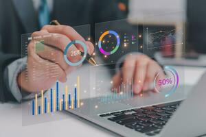 Business development and technology Data analyst for report marketing strategy planning. graph analysis and information on a futuristic virtual interface screen. photo
