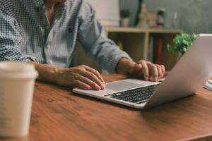 Businessperson using keyboard laptop computer job search, communication social networking, internet online Information, working data marketing concept. photo