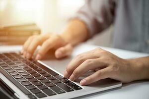 Businessperson using keyboard laptop computer job search, communication social networking, internet online Information, working data marketing concept. photo