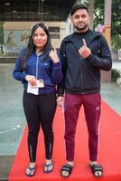 Delhi, India - July 04 2023 - Unidentified people showing their ink-marked fingers after casting votes in front of polling booth of east Delhi area for MCD local body Elections 2022 photo