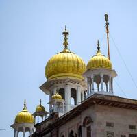 New Delhi, India, May 23 2023 - Gurudwara Sis Ganj Sahib is one of the nine historical Gurdwaras in Old Delhi in India, Sheesh Ganj Gurudwara in Chandni Chowk, opposite Red Fort in Old Delhi India photo