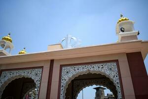 New Delhi, India, May 23 2023 - Gurudwara Sis Ganj Sahib is one of the nine historical Gurdwaras in Old Delhi in India, Sheesh Ganj Gurudwara in Chandni Chowk, opposite Red Fort in Old Delhi India photo