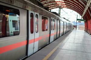 Delhi, India, May 31 2023 - Delhi Metro train arriving at Jhandewalan metro station in New Delhi, India, Asia, Public Metro departing from Jhandewalan station in which more than 20 lakhs passengers photo