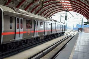 Delhi, India, May 31 2023 - Delhi Metro train arriving at Jhandewalan metro station in New Delhi, India, Asia, Public Metro departing from Jhandewalan station in which more than 20 lakhs passengers photo