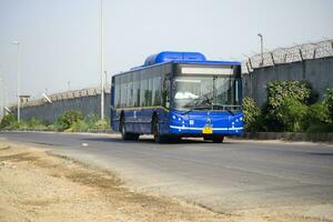 New Delhi, India - April 16, 2023 - View of Vehicles passing through the main road near Indra Gandhi International Airport Delhi at Dwarka link road photo