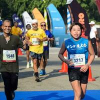 New Delhi, India - June 16 2023 - Vedanta Delhi Half Marathon race after covid in which marathon participants about to cross the finish line, Delhi Half Marathon 2022 photo