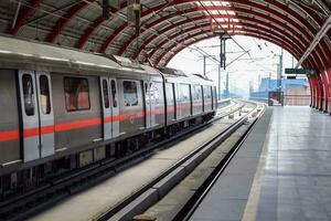 Delhi, India, May 31 2023 - Delhi Metro train arriving at Jhandewalan metro station in New Delhi, India, Asia, Public Metro departing from Jhandewalan station in which more than 20 lakhs passengers photo