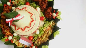 Cone Shaped Rice with Indonesian National Ribbon called Nasi Tumpeng Merah Putih For Independence Day Celebration at 17 August photo