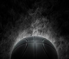 black basketball with on the smoke background photo