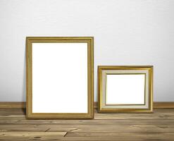 Golden picture frame in room white walls and wooden floors photo