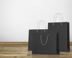 black paper bag in room white walls and wooden floor photo