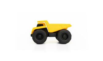 A dump truck miniature isolated on white background, after some edits. photo