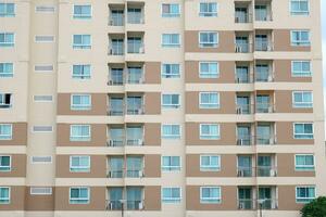 Simple geometric shape style of building condominium painted brown and light brown color, Thailand. photo