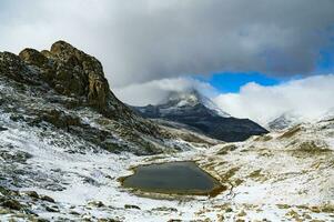 The panoramic scene of the Riffelsee and the Matterhorn in the white snow in winter is unusual and spectacular. It is another popular place to take pictures. photo