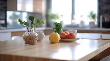 Fruits in plate on table on background of blurred contemporary kitchen. photo