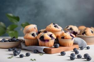 Blueberry muffins with fresh blueberries on a white table, close up, light background. A delicious dessert or breakfast. AI generated. photo