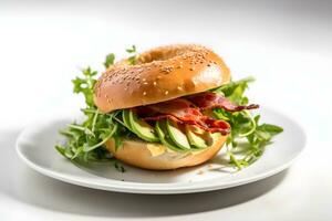 Fresh bagel bun with bacon, avocado and green salad on white table, light background. Copy space. AI generated. photo