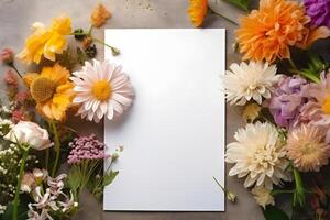 Blank greeting card mockup on concrete background with garden flowers. Summer flat lay composition. Top view with copy space. AI generated. photo