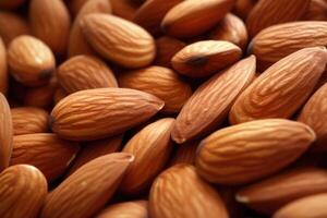 Roasted peeled almond nuts texture, top view. Almond nuts background. photo