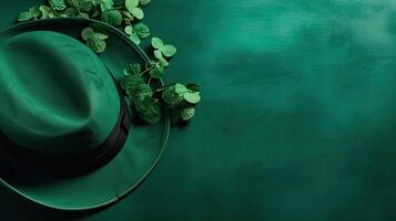 Top View of St Patrick's banner concept design of green hat and green leaves on green pastel background, photo