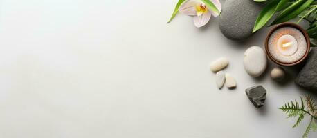 Photo of a minimalist table decoration with rocks and a candle with copy space