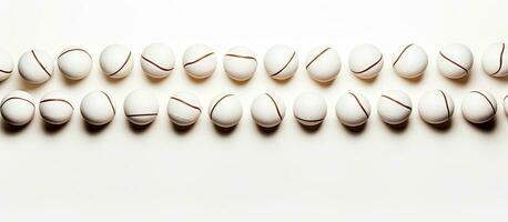 Photo of a cluster of white balls arranged in a minimalist composition with copy space