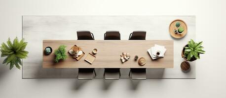 Photo of a table set with chairs and a potted plant, ready for a gathering or meal with copy space