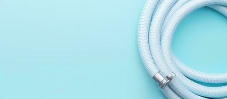 Photo of a white cord on a blue background, perfect for adding your own text or design with copy space