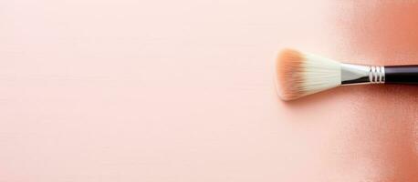 Photo of a close up of a brush on a pink surface with copy space with copy space