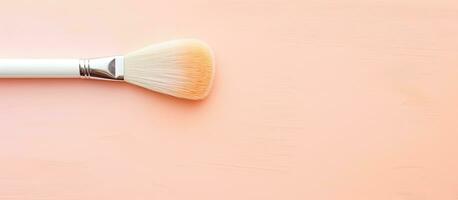 Photo of a makeup brush on a vibrant pink background, perfect for beauty and cosmetic themed designs with copy space