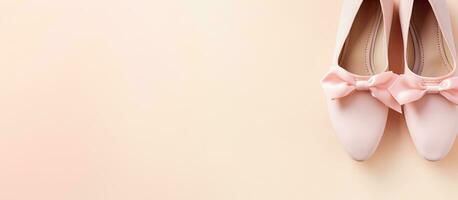 Photo of a pair of pink shoes hanging on a wall with plenty of copy space with copy space