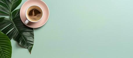 Photo of a cup of coffee on a saucer next to a plant with copy space with copy space