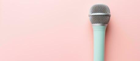 Photo of a microphone on a vibrant pink background with plenty of space for text or graphics with copy space