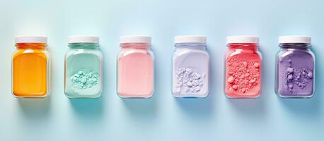 Photo of a colorful row of liquid filled bottles with empty space for text or design with copy space